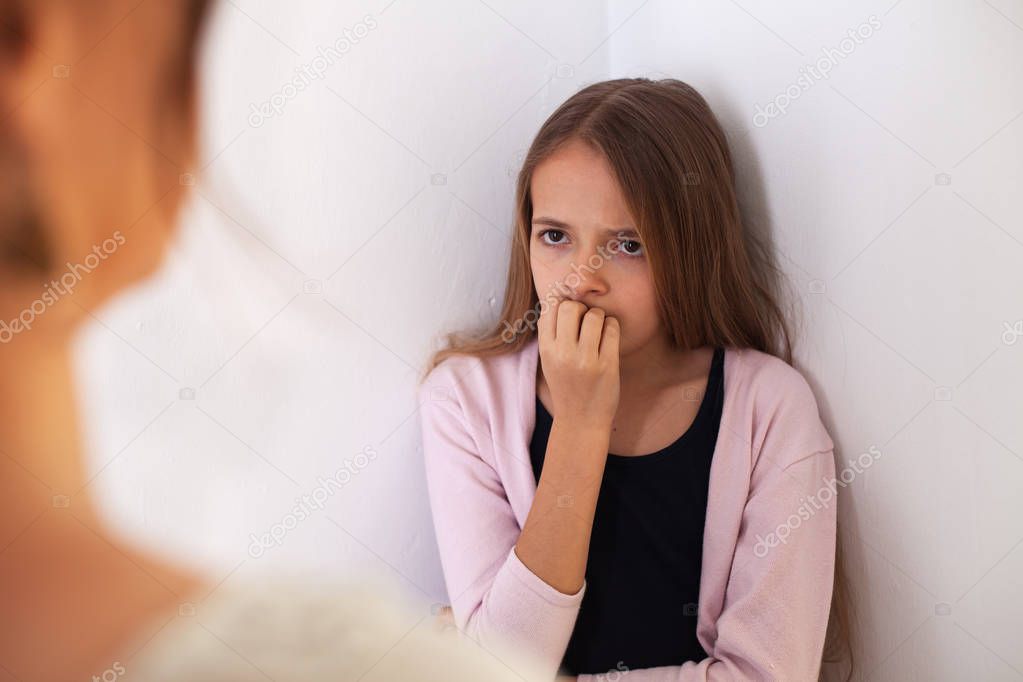 Mother and teenage daughter having a confrontation - young girl 