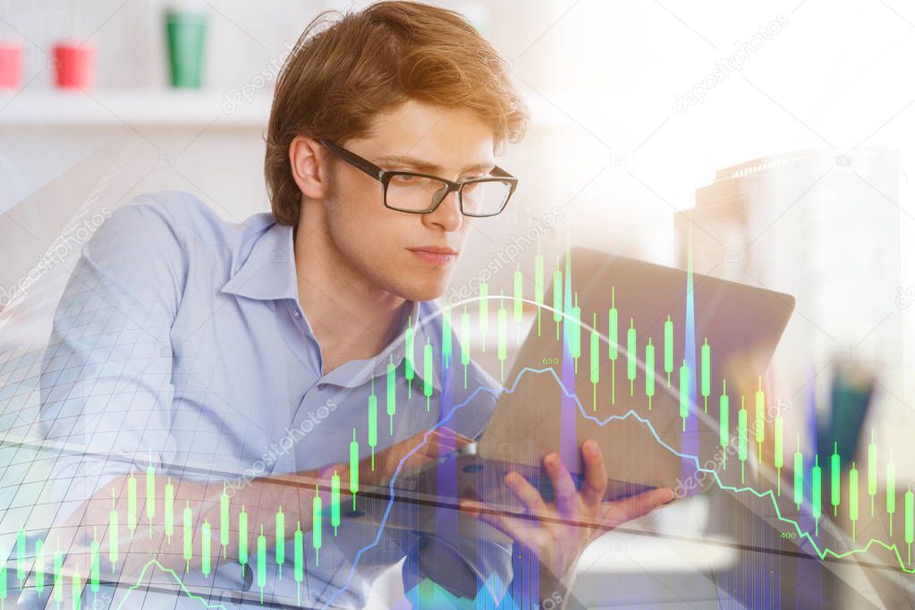 Businessman using laptop in abstract office interior with forex chart. Accounting and finance concept. Double exposure 