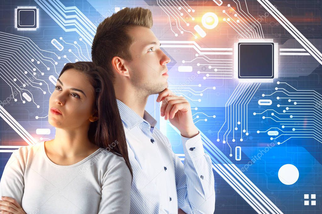 Portrait of attractive young businessman and woman standing on abstract circuit background. Teamwork and computing concept