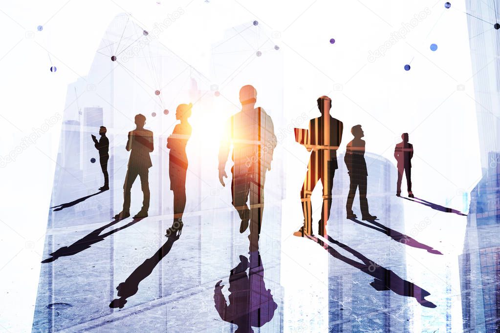 Teamwork, success and employment concept. Businesspeople silhouettes on abstract city background with sunlight. Double exposure 