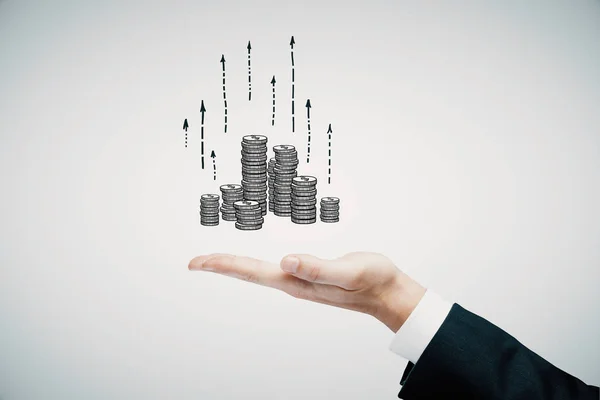 Dubbele belichting met groei munten kolommen en man hand. Concept van succes besparingen en kapitaal. — Stockfoto