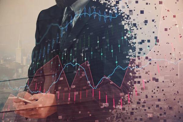 Double exposure of businessman using cell phone and stock market charts. Financial concept.