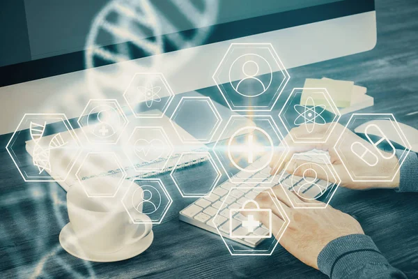 DNA hologram met zakenman werkend op computer op de achtergrond. Concept van bio-engineering. Dubbele blootstelling. — Stockfoto