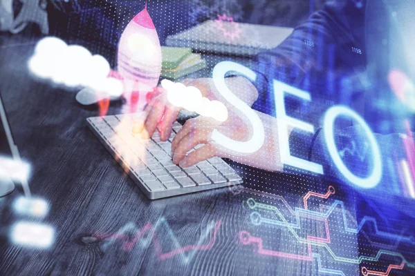 Multi exposure of seo icon with man working on computer on background. Concept of search engine optimization. — Stock Photo, Image