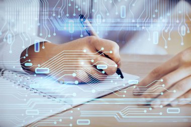 Teknoloji simgeleriyle insan eli yazmak.