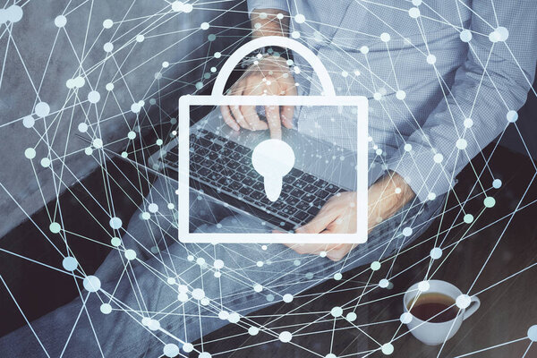 Multi exposure of lock icon with man working on computer on background. Concept of network protection.