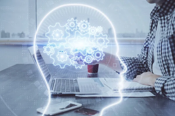 Man skriver på tangentbord bakgrund med hjärnan hologram. Begreppet big data. Dubbel exponering. — Stockfoto