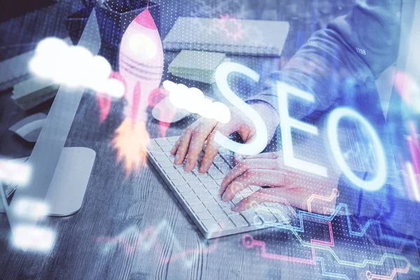 Double exposure of seo icon with man working on computer on background. Concept of search engine optimization. — Stock Photo, Image