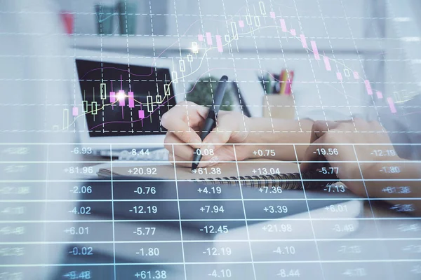 Financial graph displayed on woman's hand taking notes background. Concept of research. Multi exposure