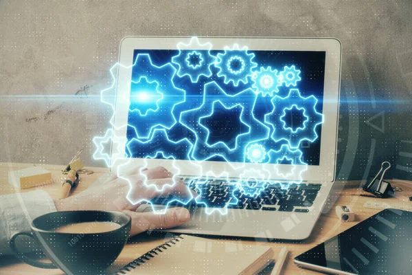 Dubbel exponering av affärsman som arbetar på laptop på bakgrunden. Internationella affärs hologram framför. Koncept för framgång. — Stockfoto