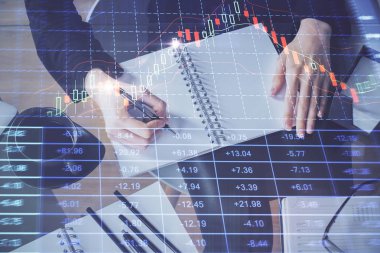 Forex grafik hologram el notları arka plan alarak. Analiz kavramı. Çoklu pozlama