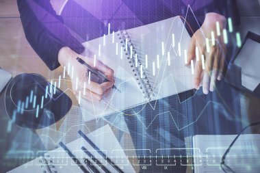 Forex grafik hologram el notları arka plan alarak. Analiz kavramı. Çoklu pozlama