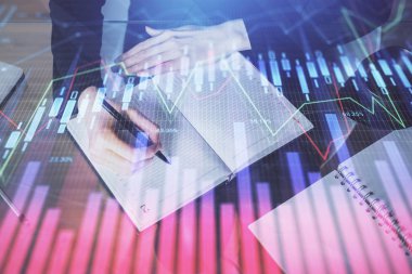 Forex grafik hologram el notları arka plan alarak. Analiz kavramı. Çoklu pozlama