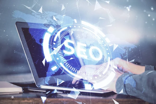 Double exposure of seo icon with man working on computer on background. Concept of search engine optimization. — Stock Photo, Image