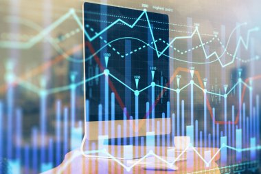 Finansal tablo çizimi ve arka planda bilgisayar olan bir tablo. Çoklu maruz kalma. Uluslararası pazarlar kavramı.
