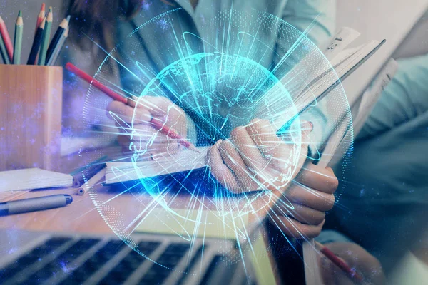 International Business hologram over handen het nemen van notities achtergrond. Concept van succes. Multi exposure — Stockfoto