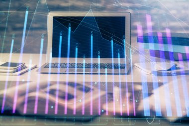Finansal grafik renkli çizimler ve arka planda bilgisayar olan tablolar. Çoklu maruz kalma. Uluslararası pazarlar kavramı.