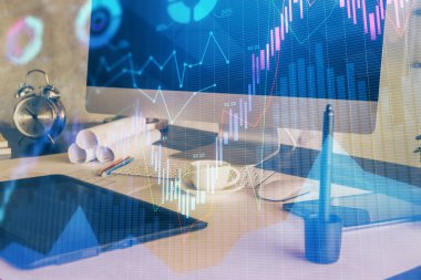 Finansal tablo çizimi ve arka planda bilgisayar olan bir tablo. Çoklu maruz kalma. Uluslararası pazarlar kavramı.