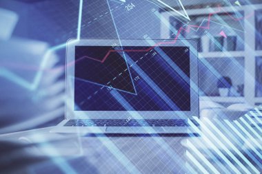 Finansal tablo çizimi ve arka planda bilgisayar olan bir tablo. Çoklu maruz kalma. Uluslararası pazarlar kavramı.