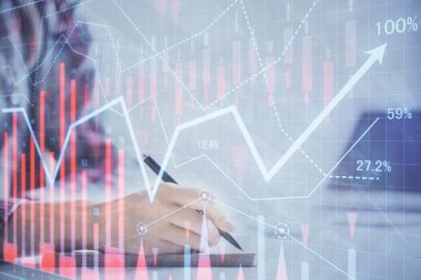 Bir kadın eller Not defteri hisse senedi piyasası hakkında bilgi yazma. Ön Forex grafik hologramlar. Araştırma kavramı. Çift Pozlama