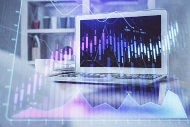 Finansal pazar grafiği hologramı ve kişisel bilgisayar arka planda. Çifte maruziyet. Önx kavramı.