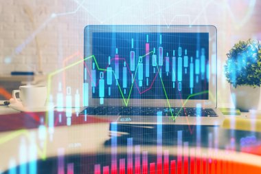 Finansal tablo çizimi ve arka planda bilgisayar olan bir tablo. Çifte maruziyet. Uluslararası pazarlar kavramı.