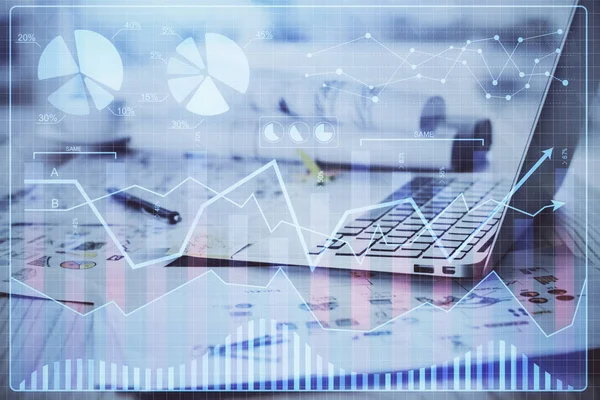 Financial market graph hologram and personal computer on background. Double exposure. Concept of forex.