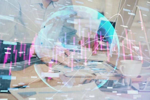 Multi exposure of chart with man typing on computer in office on background. Concept of hard work. — Stock Photo, Image