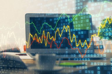 Finansal pazar grafiği hologramı ve kişisel bilgisayar arka planda. Çifte maruziyet. Önx kavramı.