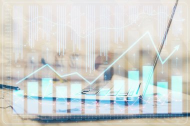 Arka planda eski pazar grafik hologramı ve kişisel bilgisayar var. Çifte maruziyet. Yatırım kavramı.