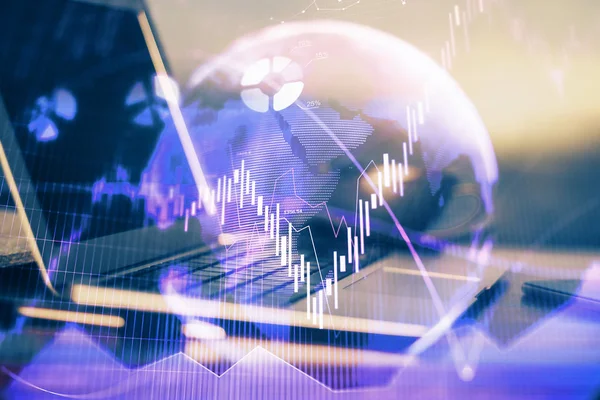 Financial graph colorful drawing and table with computer on background. Double exposure. Concept of international markets.