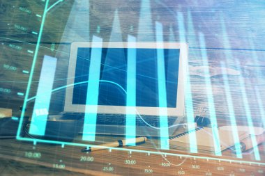 Finansal grafik renkli çizimler ve arka planda bilgisayar olan tablolar. Çifte maruziyet. Uluslararası pazarlar kavramı.