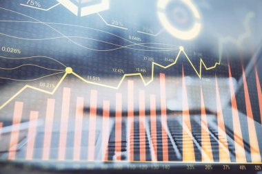 Finansal pazar grafiği hologramı ve kişisel bilgisayar arka planda. Çifte maruziyet. Önx kavramı.