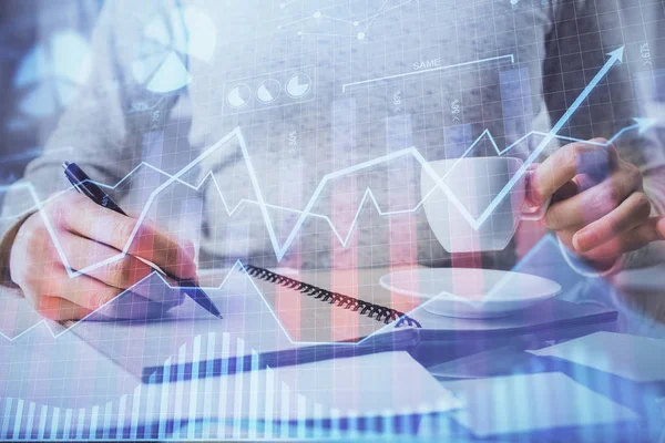 Forex chart hologram on hand taking notes background. Concept of analysis. Double exposure — Stock Photo, Image