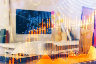 Finansal tablo çizimi ve arka planda bilgisayar olan bir tablo. Çoklu maruz kalma. Uluslararası pazarlar kavramı.