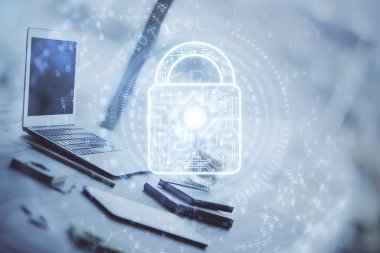 Bilgisayar ve ikon hologramı ile masaüstüne çift pozlama. Veri güvenliği kavramı.