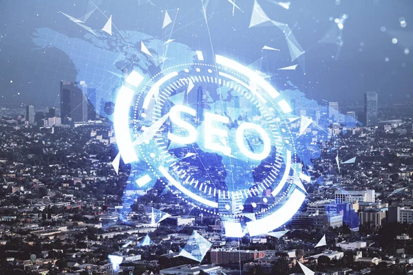 SEO hologram on city view with skyscrapers background double exposure. Search optimization concept. — Stock Photo, Image