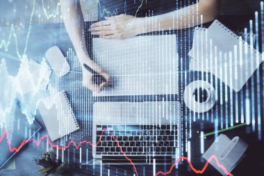 Finansal grafik WOMANS el notları arka plan alarak görüntülenir. Araştırma kavramı. Çoklu pozlama