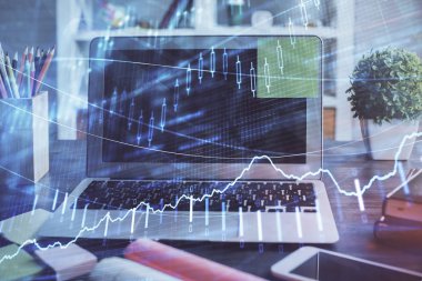 Finansal pazar grafiği hologramı ve kişisel bilgisayar arka planda. Çifte maruziyet. Önx kavramı.