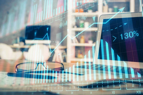 Double exposure of forex chart and work space with computer. Concept of international online trading.