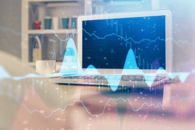 Finansal tablo çizimi ve arka planda bilgisayar olan bir tablo. Çoklu maruz kalma. Uluslararası pazarlar kavramı.