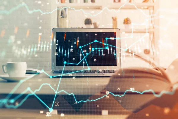 Financial graph colorful drawing and table with computer on background. Double exposure. Concept of international markets.