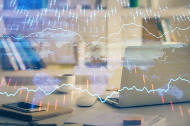 Finansal grafik renkli çizimler ve arka planda bilgisayar olan tablolar. Çifte maruziyet. Uluslararası pazarlar kavramı.