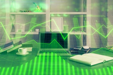 Finansal pazar grafiği hologramı ve kişisel bilgisayar arka planda. Çoklu maruz kalma. Önx kavramı.