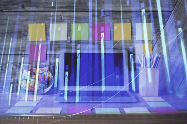 Grafik ve finansal bilgilere çifte maruz kalma ve bilgisayar geçmişi olan çalışma alanı. Uluslararası çevrimiçi ticaret kavramı.