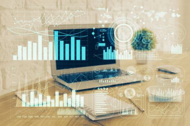 Finansal grafik renkli çizimler ve arka planda bilgisayar olan tablolar. Çifte maruziyet. Uluslararası pazarlar kavramı.