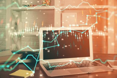 Finansal grafik renkli çizimler ve arka planda bilgisayar olan tablolar. Çifte maruziyet. Uluslararası pazarlar kavramı.