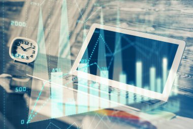 Finansal grafik renkli çizimler ve arka planda bilgisayar olan tablolar. Çoklu maruz kalma. Uluslararası pazarlar kavramı.