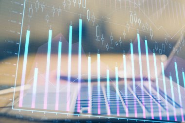 Finansal grafik renkli çizimler ve arka planda bilgisayar olan tablolar. Çoklu maruz kalma. Uluslararası pazarlar kavramı.