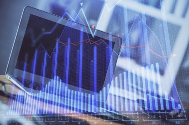 Finansal grafik renkli çizimler ve arka planda bilgisayar olan tablolar. Çoklu maruz kalma. Uluslararası pazarlar kavramı.